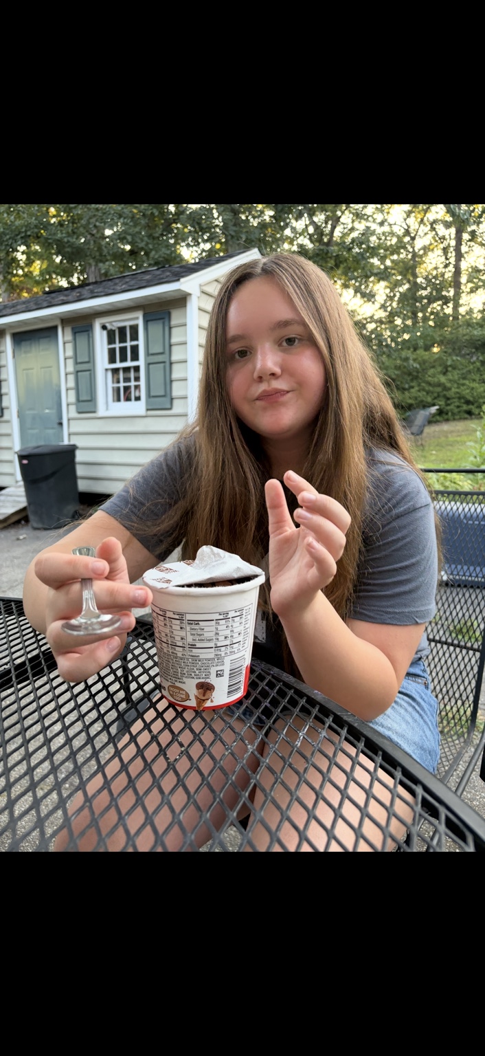 Leia enjoying Kinder Bueno ice cream at an outdoor table